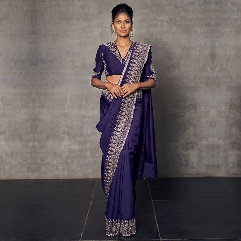 Jayanti Reddy - The JR Double-Saree Drape This is what modern saree-styling  dreams are made of! Six-yard Benarasi silks, stunning just as they are, in  red and purple embroidered elegance. A signature