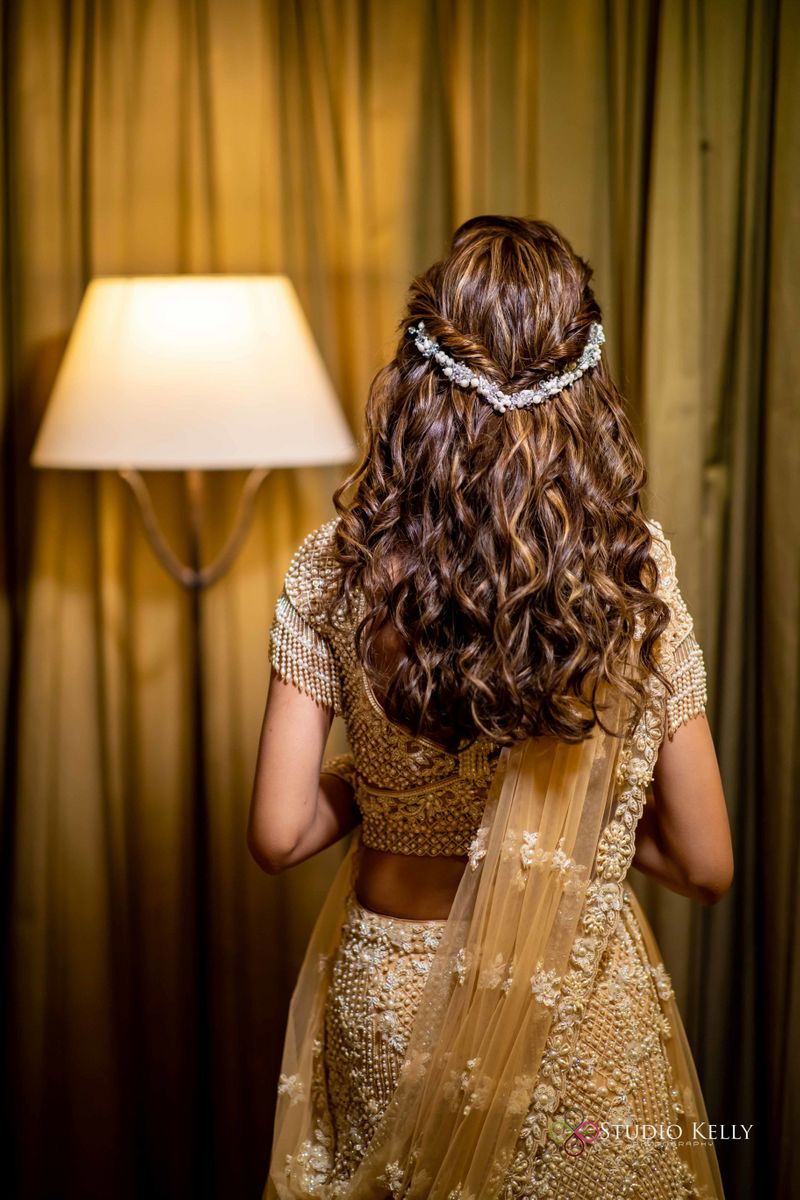 Photo of Open hair with natural curls and hair clips