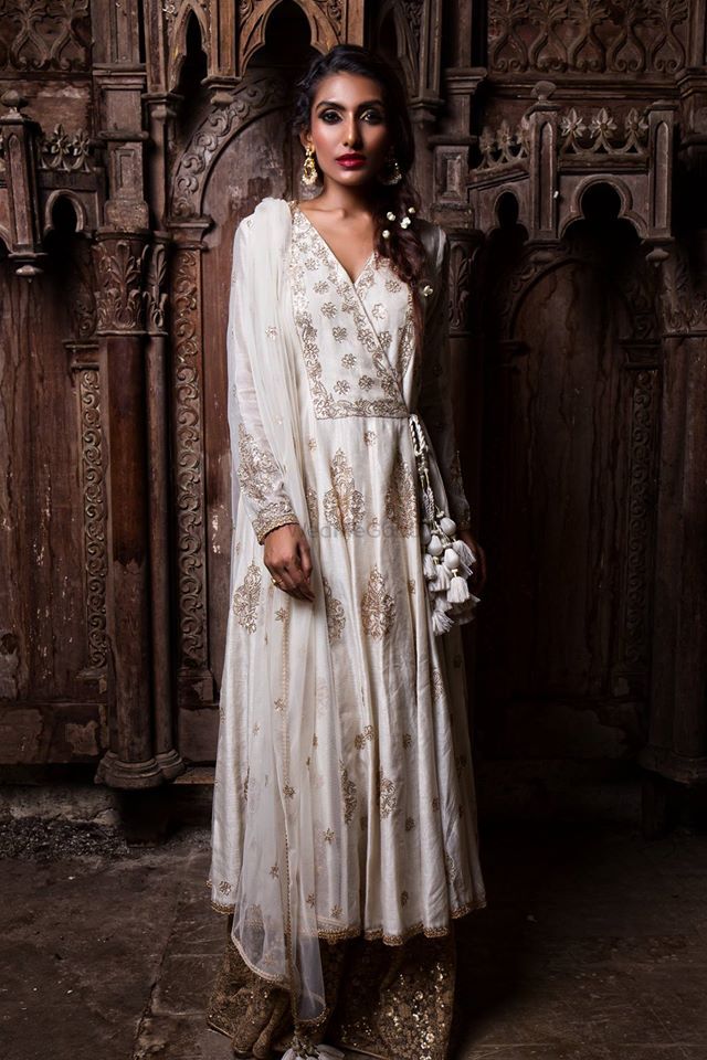 Photo of White anarkali with tassels and gold sequin sharara