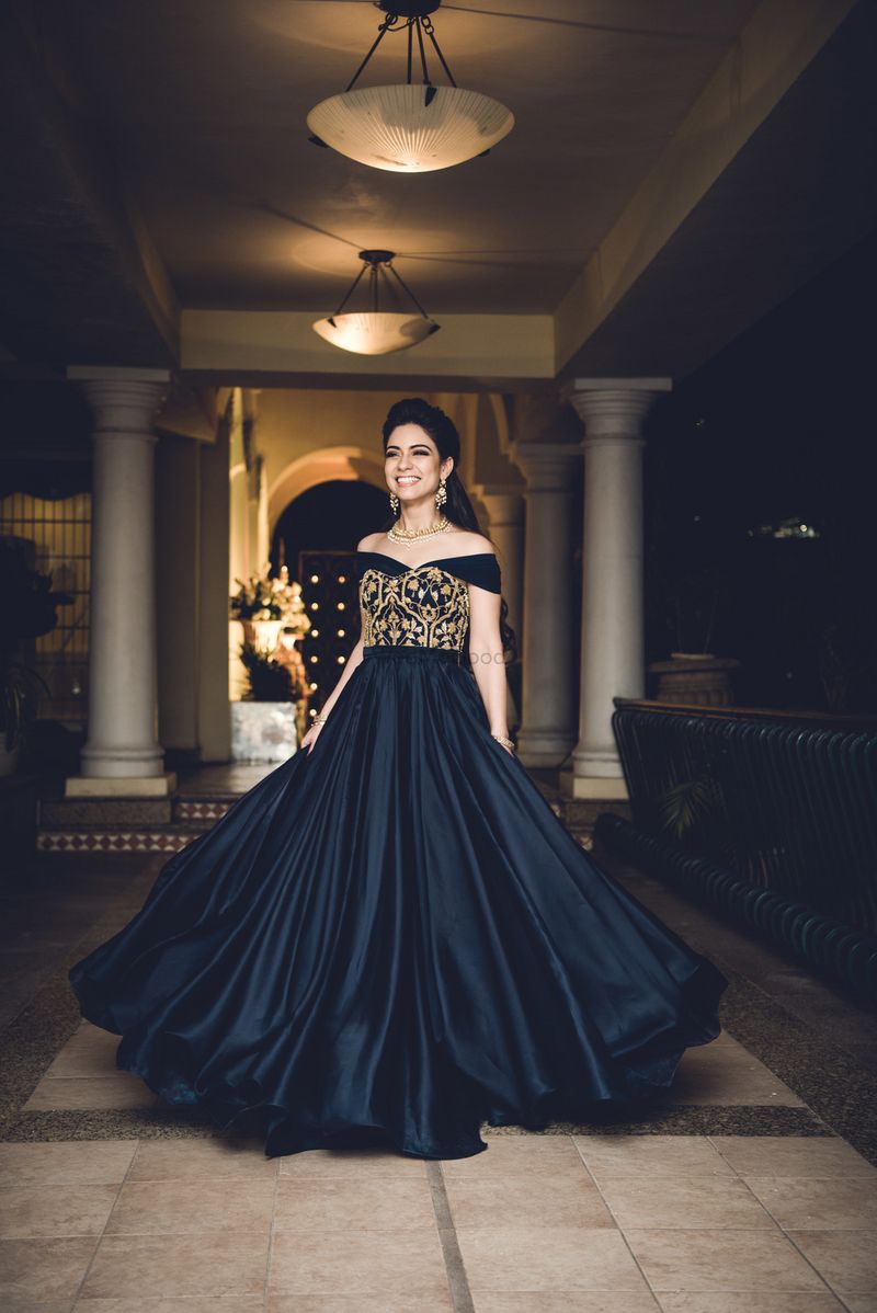 Black and gold cocktail gown with off shoulder