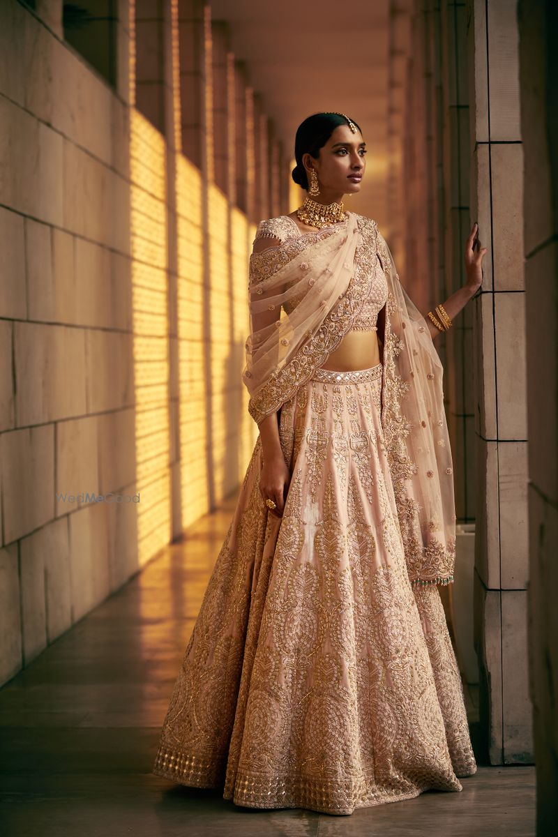 Peachish pink velvet kalidar lehenga by Frontier Raas
