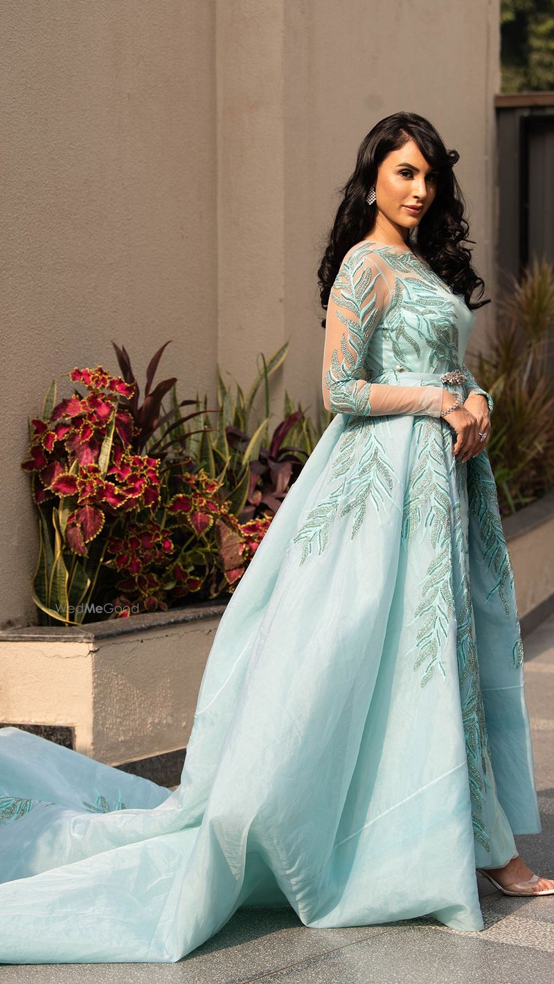 blue gown with belt brooch by Bride 