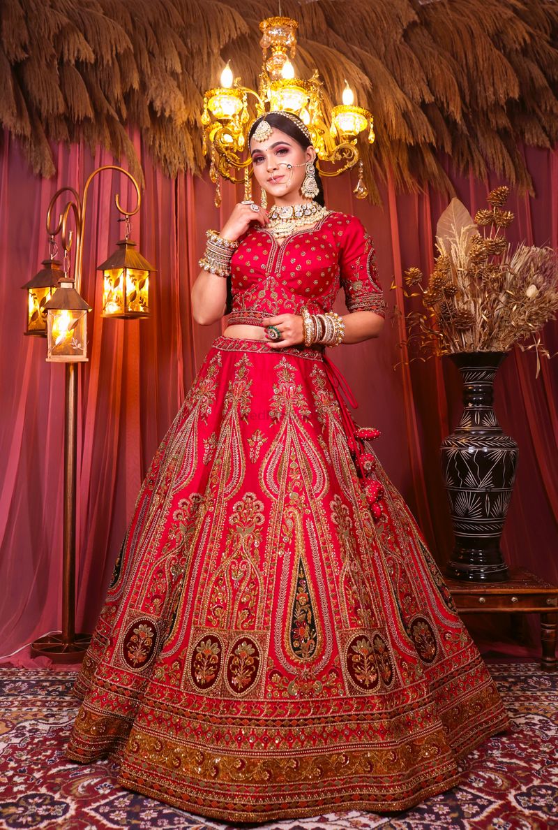 red raw silk lehenga & choli with all over hand embroidery. It comes ...