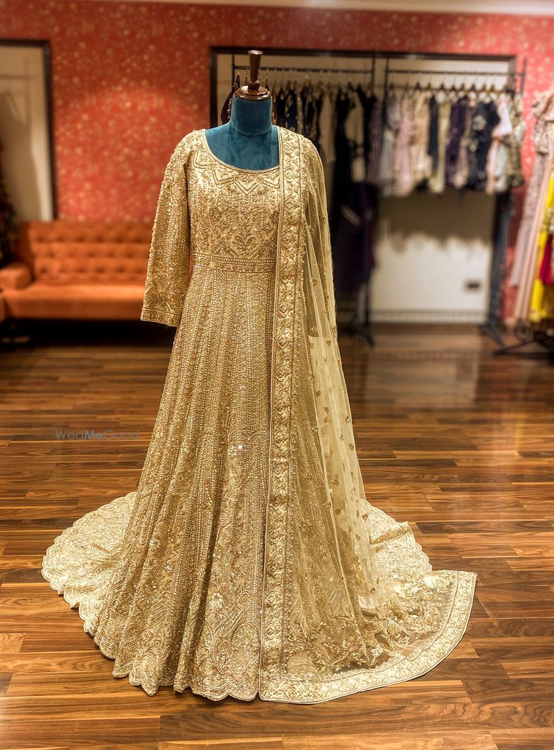 Anarkali in golden colour designed with a beautiful silhouette, intricate  thread and dabka work